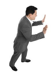 Businessman in suit posing on white background, above view