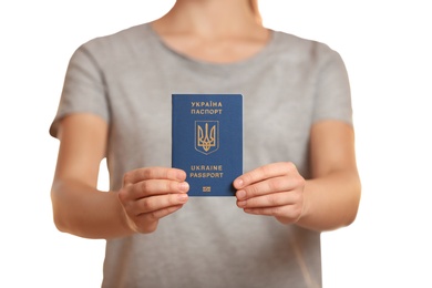 Photo of Woman holding Ukrainian travel passport against blurred background, closeup. International relationships