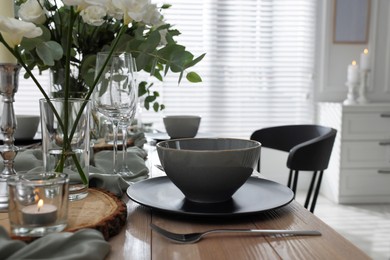 Photo of Festive table setting with beautiful tableware and decor indoors