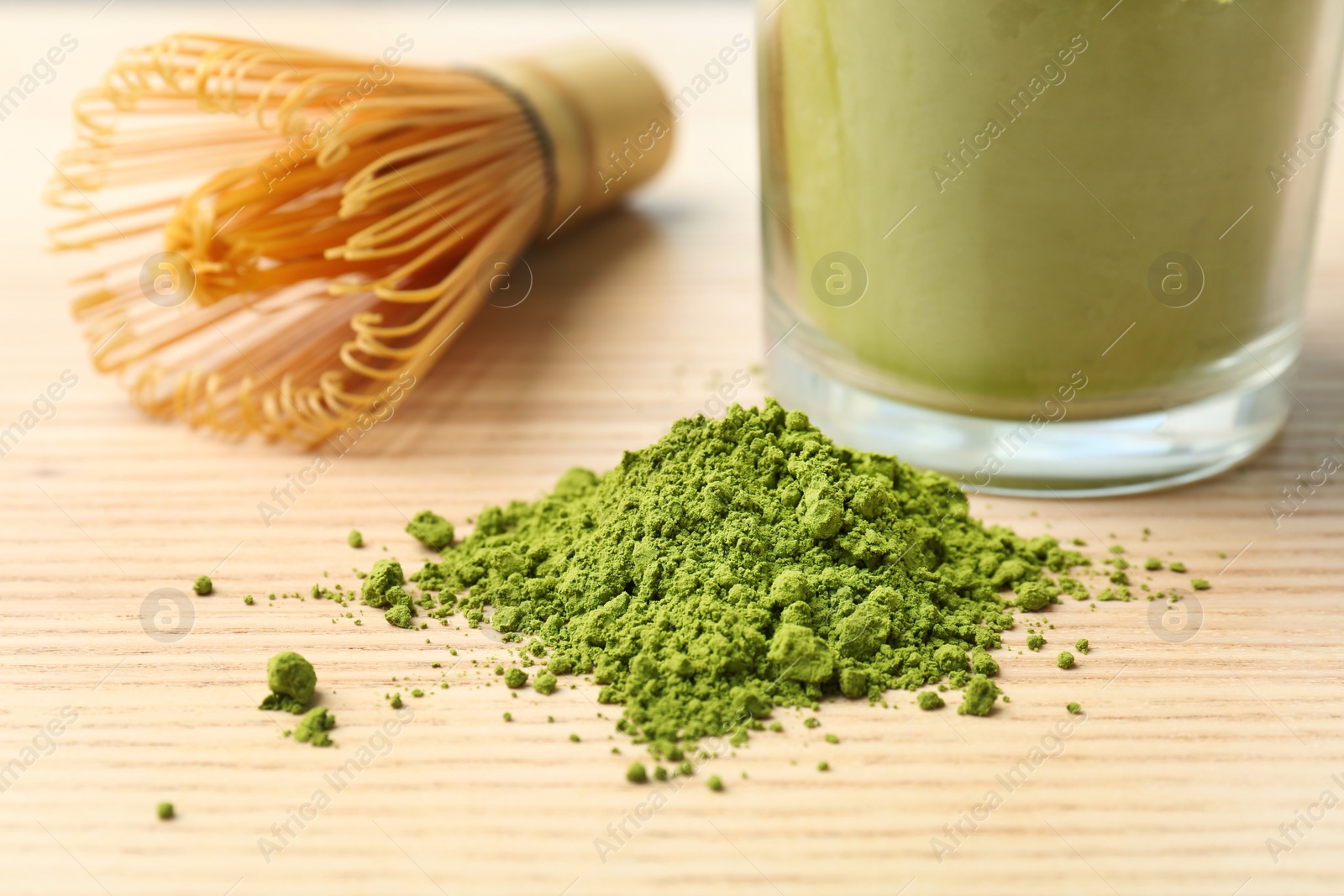 Photo of Powdered matcha tea and chasen on table