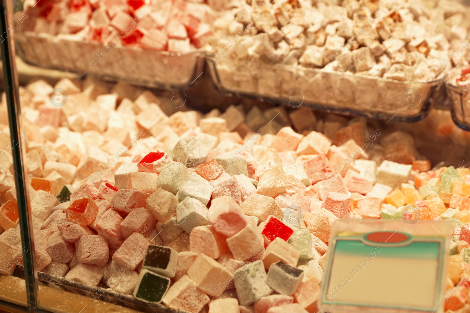 Photo of Shop with turkish delight, view through window glass