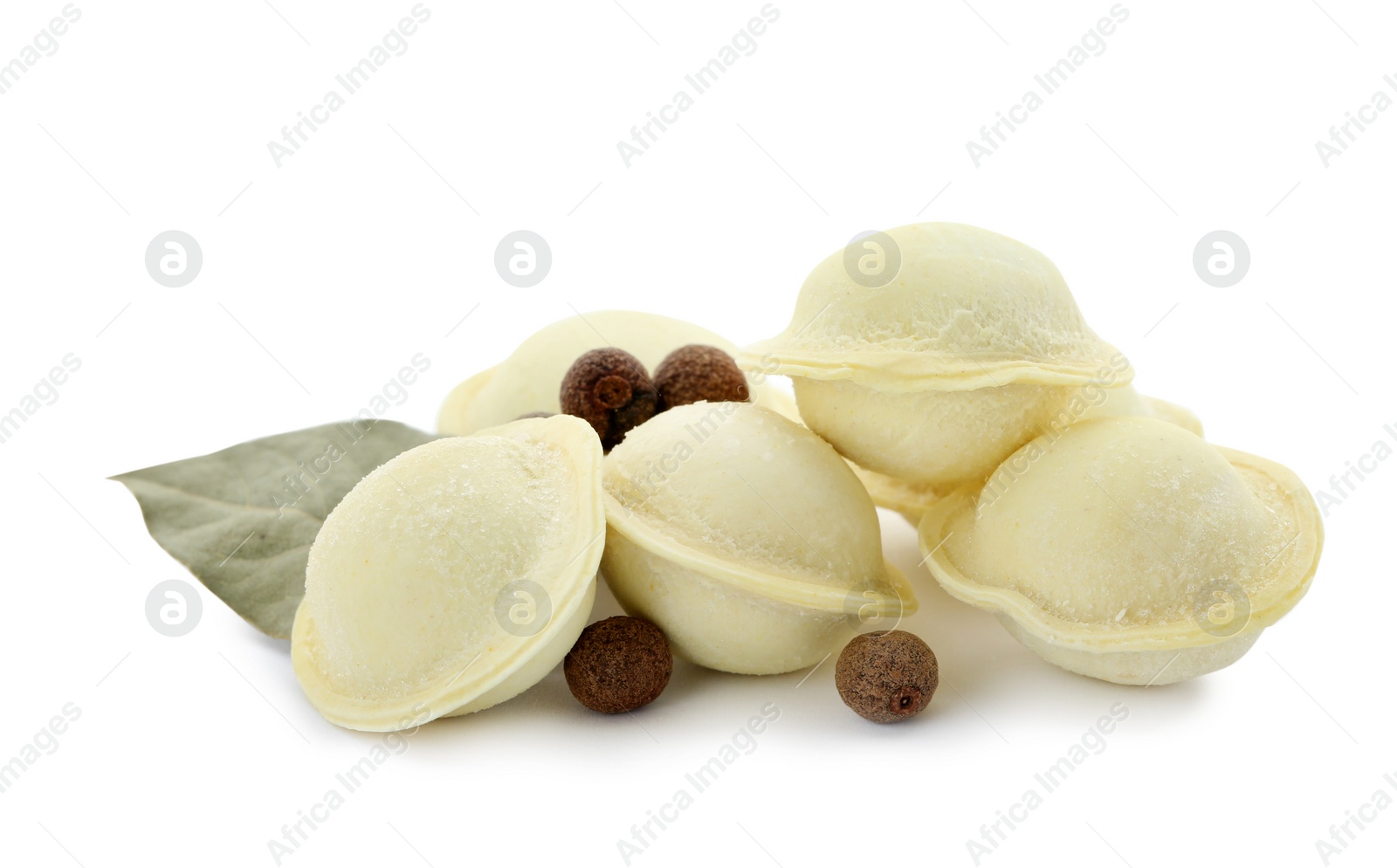 Photo of Raw meat dumplings with bay leaf on white background