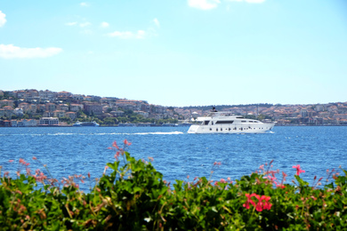 Beautiful view of sea, boat and blue sky on sunny day