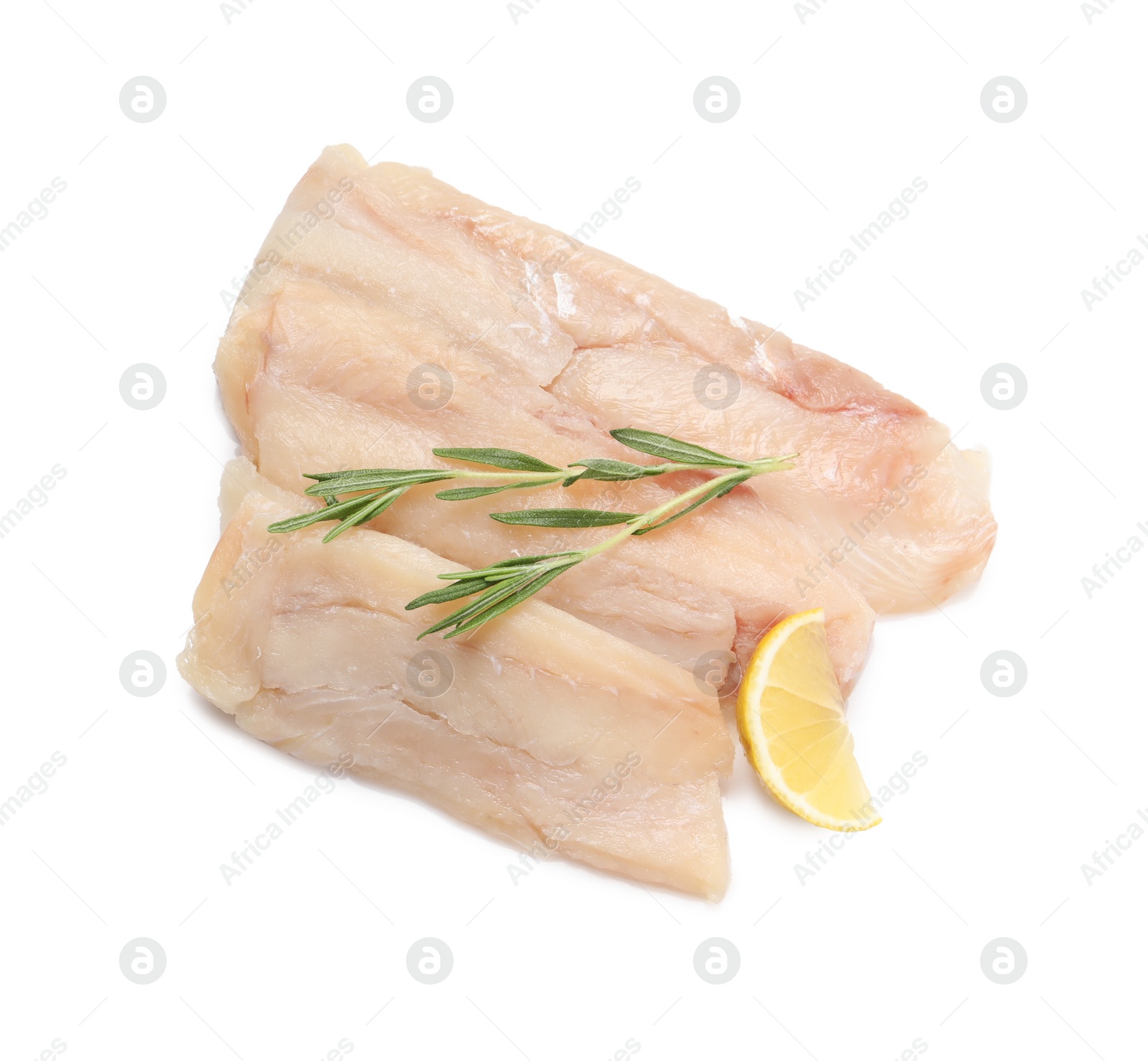 Photo of Pieces of raw cod fish, rosemary and lemon isolated on white, top view