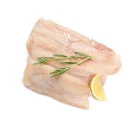 Pieces of raw cod fish, rosemary and lemon isolated on white, top view