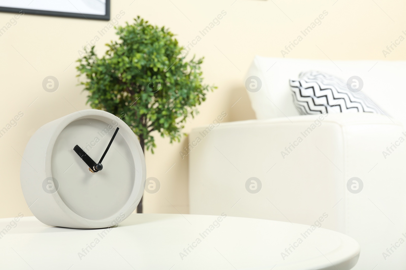 Photo of Analog clock on table indoors, space for text. Time management