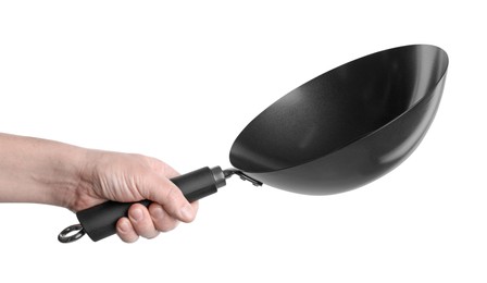 Man holding empty metal wok on white background, closeup