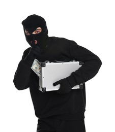 Photo of Thief in balaclava with briefcase of money showing hush gesture on white background