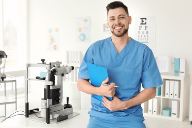 Photo of Portrait of smiling ophthalmologist in clinic