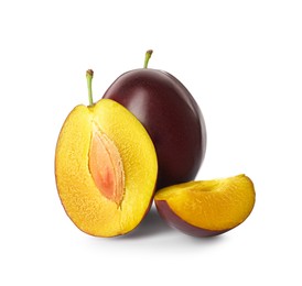 Photo of Whole and cut ripe plums on white background