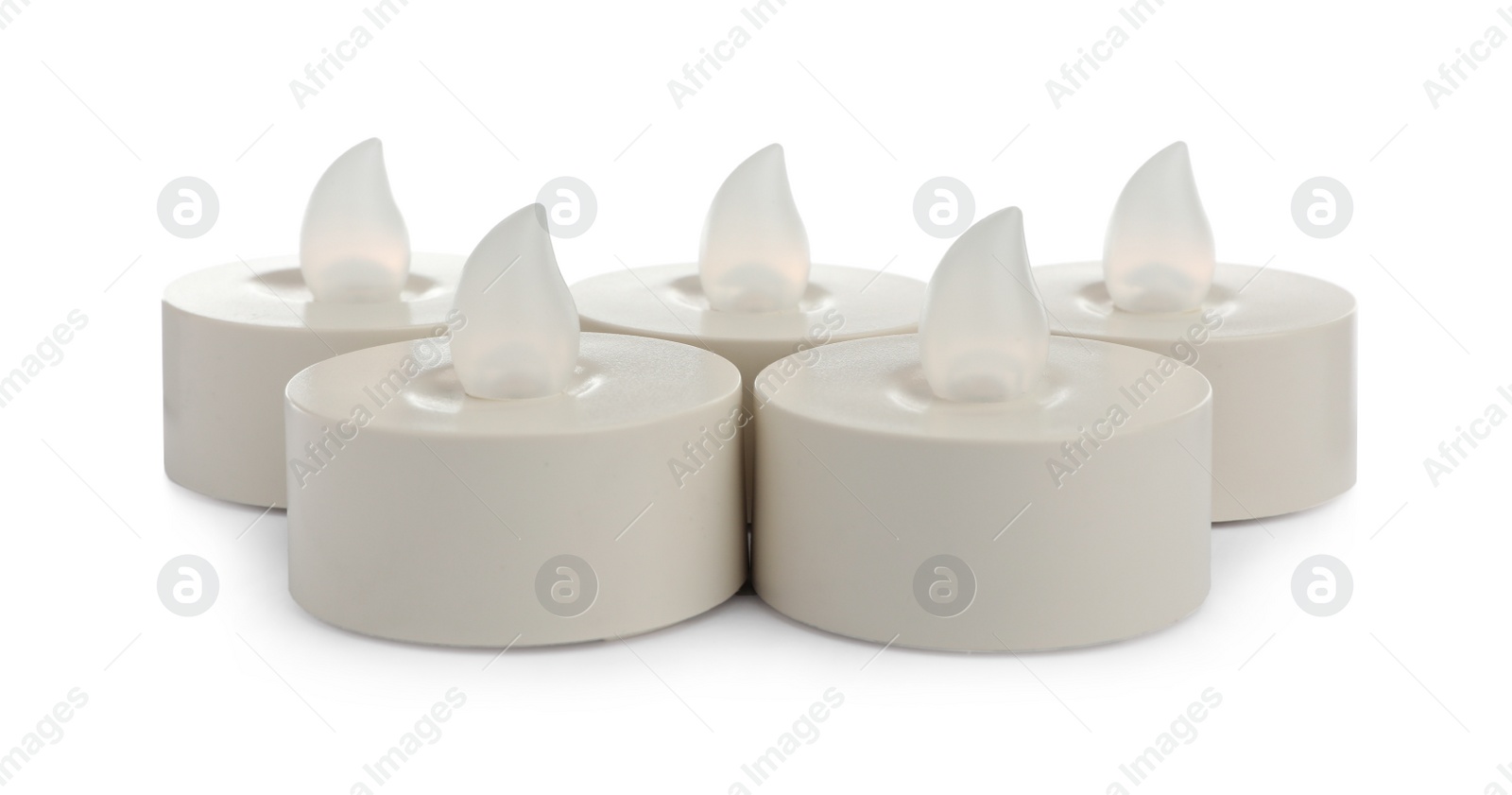 Photo of Decorative flameless LED candles on white background