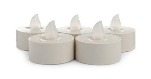 Photo of Decorative flameless LED candles on white background