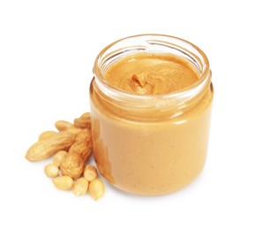 Photo of Tasty nut paste in jar and peanuts isolated on white