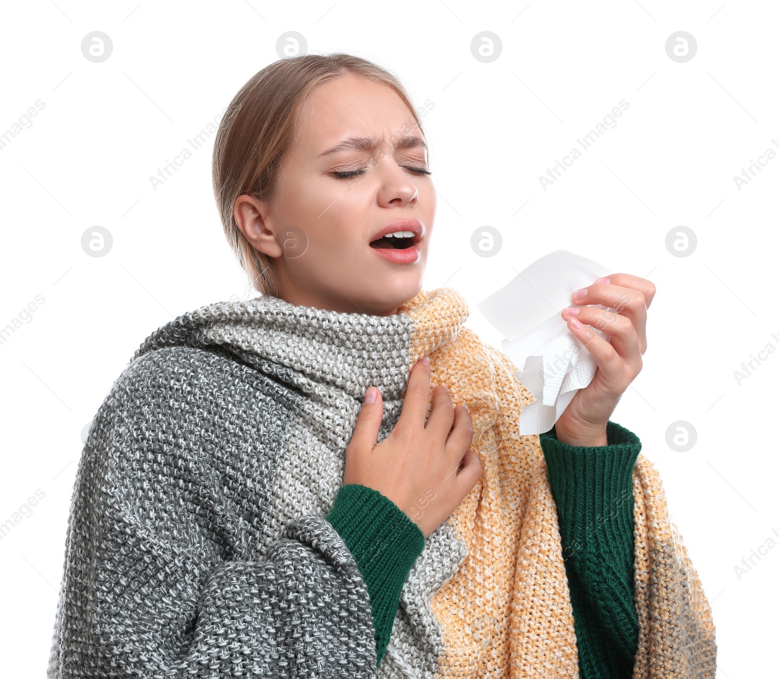 Photo of Young woman wrapped in warm blanket suffering from cold on white background