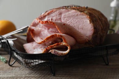 Photo of Delicious baked ham on wooden table, closeup