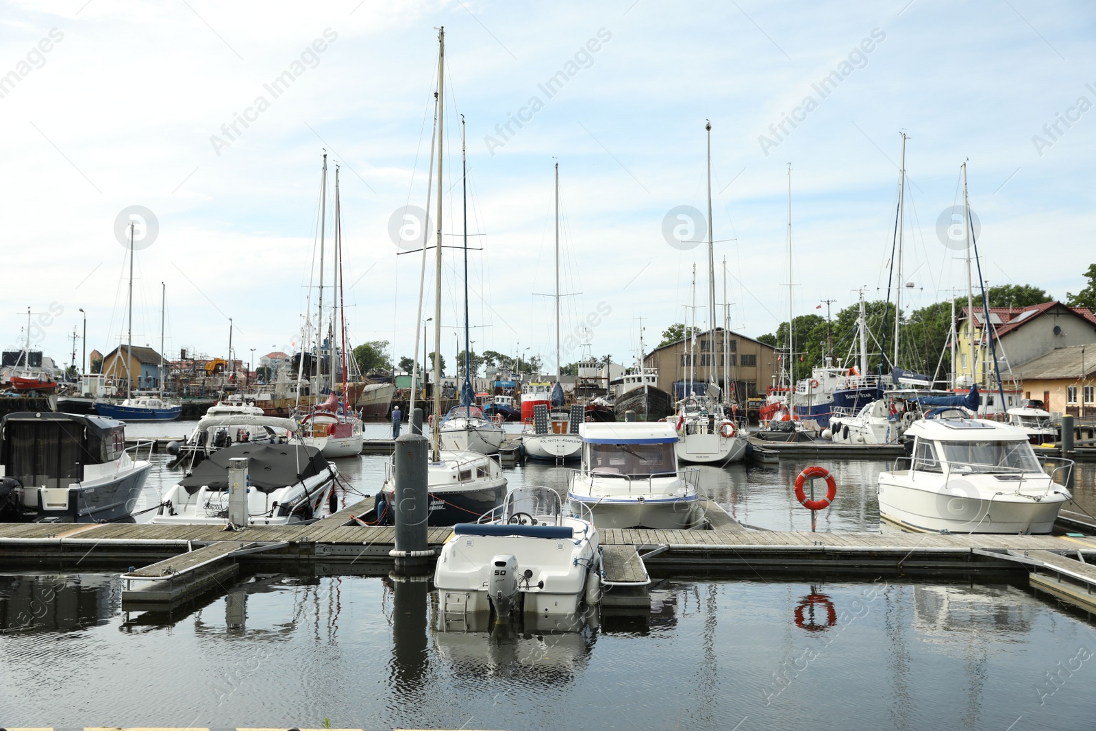 Photo of Beautiful view of city pier with modern boats