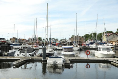 Beautiful view of city pier with modern boats