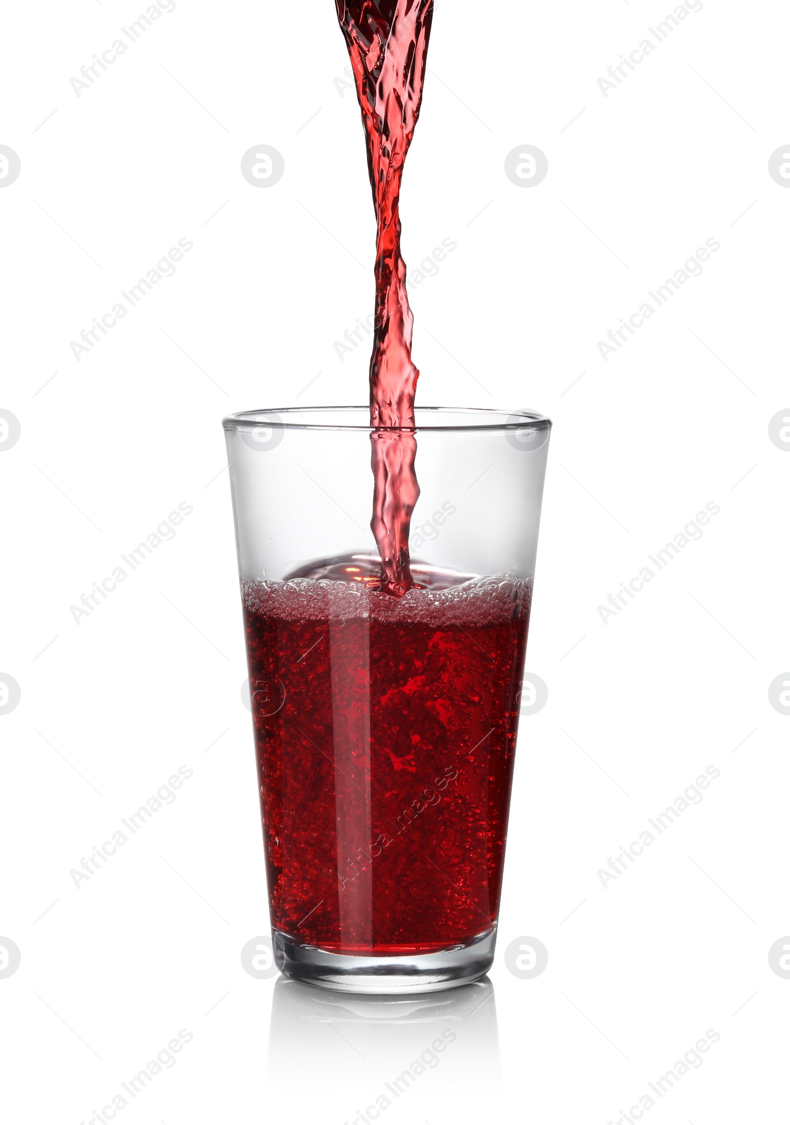 Photo of Pouring fresh juice into glass on white background