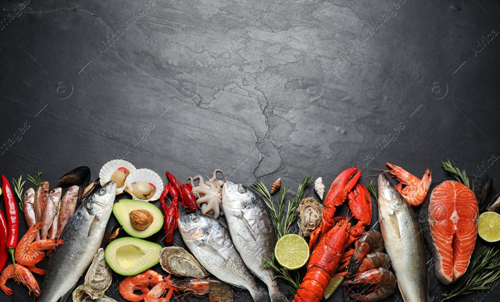 Photo of Fresh fish and different seafood on black table, flat lay. Space for text