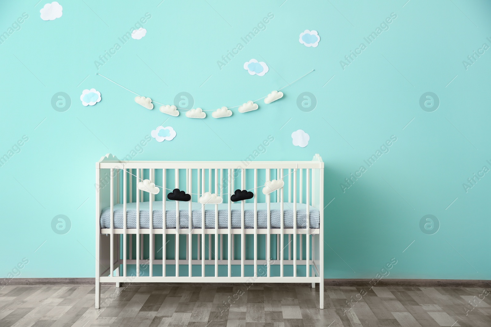 Photo of Modern baby room interior with crib