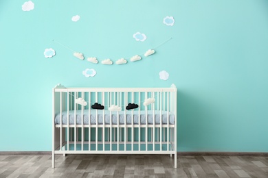 Modern baby room interior with crib