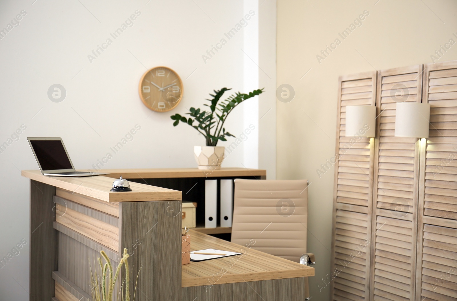 Photo of Receptionist desk in hotel. Workplace interior