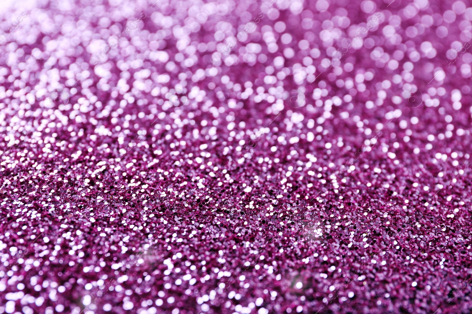 Photo of Texture of rose gold glitter as background, closeup