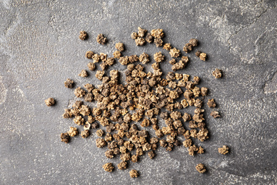 Raw beet seeds on grey background, flat lay. Vegetable planting