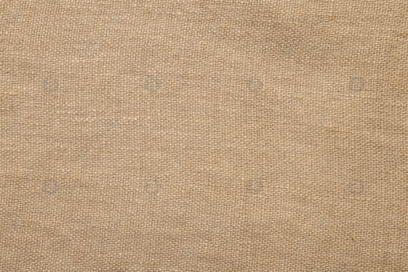 Photo of Texture of beige fabric as background, top view