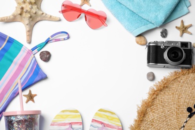 Photo of Flat lay composition with beach objects on white background. Space for text