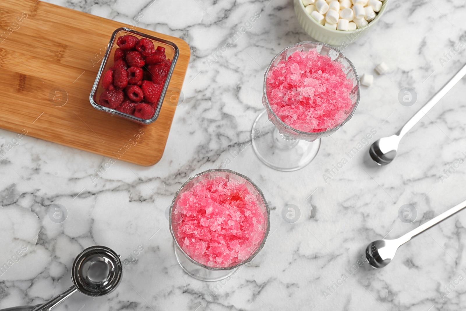 Photo of Flat lay composition with snow ice cream, raspberry and marshmallows on marble background