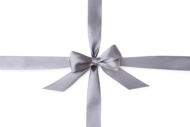 Photo of Grey satin ribbon with bow on white background, top view