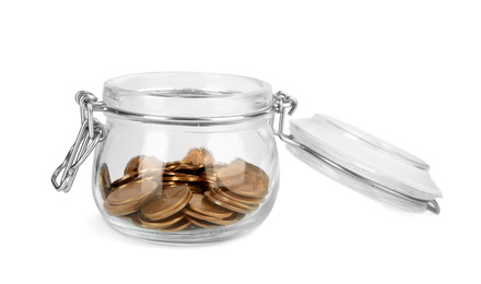 Glass jar with coins isolated on white