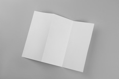 Photo of Blank paper brochure on light grey background, top view. Mockup for design