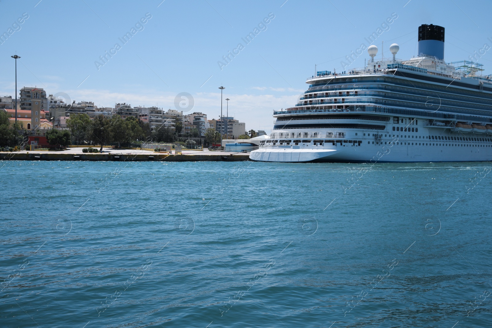 Photo of Modern cruise ship in sea on sunny day