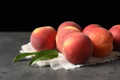 Fresh sweet ripe peaches on table