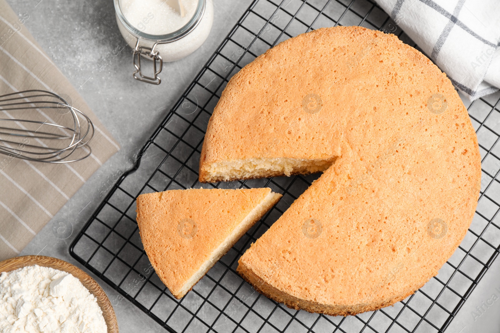 Photo of Flat lay composition with delicious fresh homemade cake on grey marble table