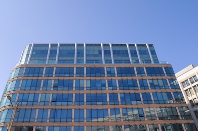 Photo of Low angle view of modern building on sunny day
