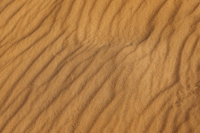 Photo of Closeup view of sand dune in desert as background