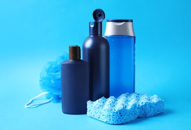 Photo of Set of different men's cosmetic products on light blue background