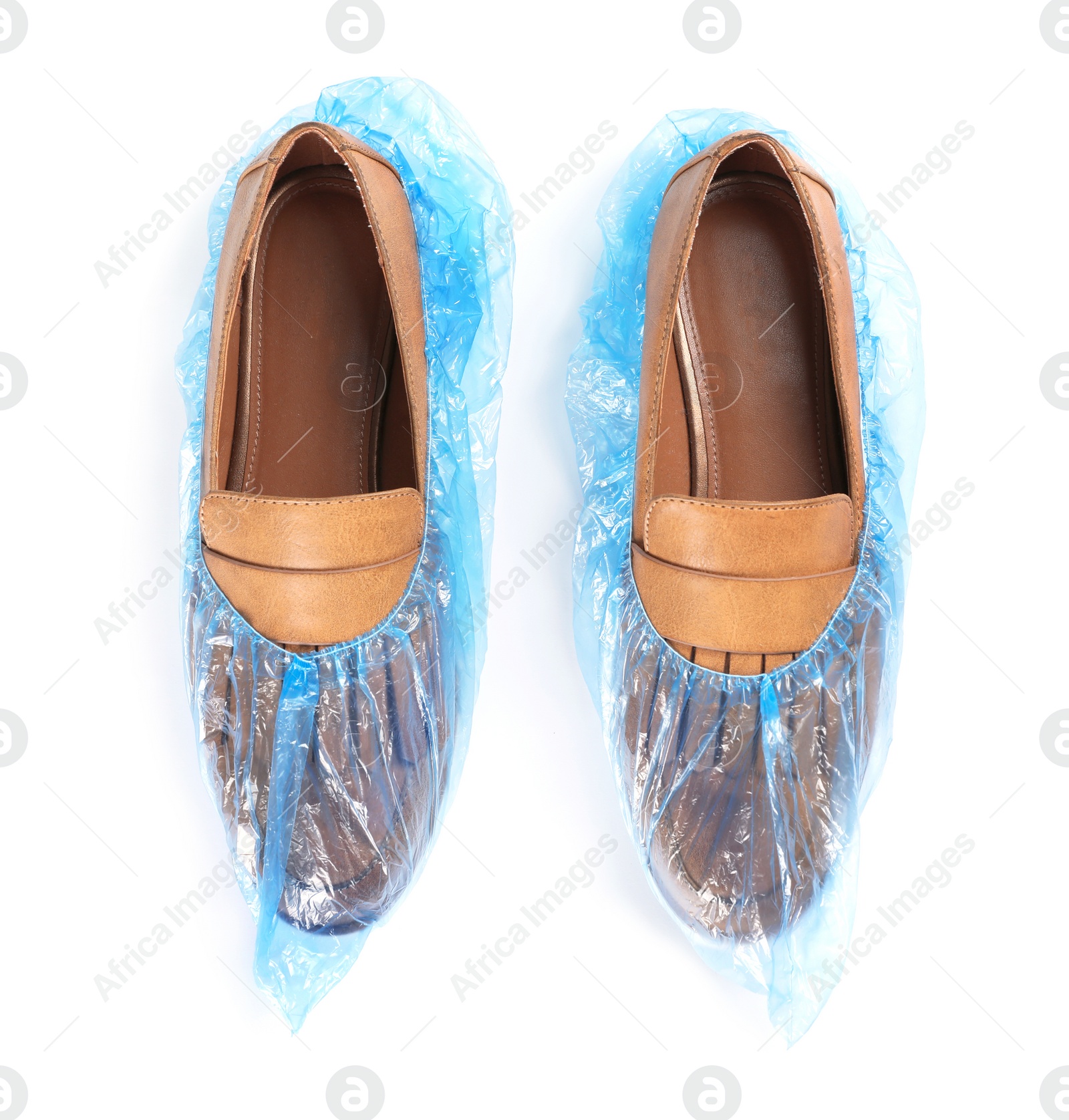 Photo of Pair of shoes in medical blue covers on white background