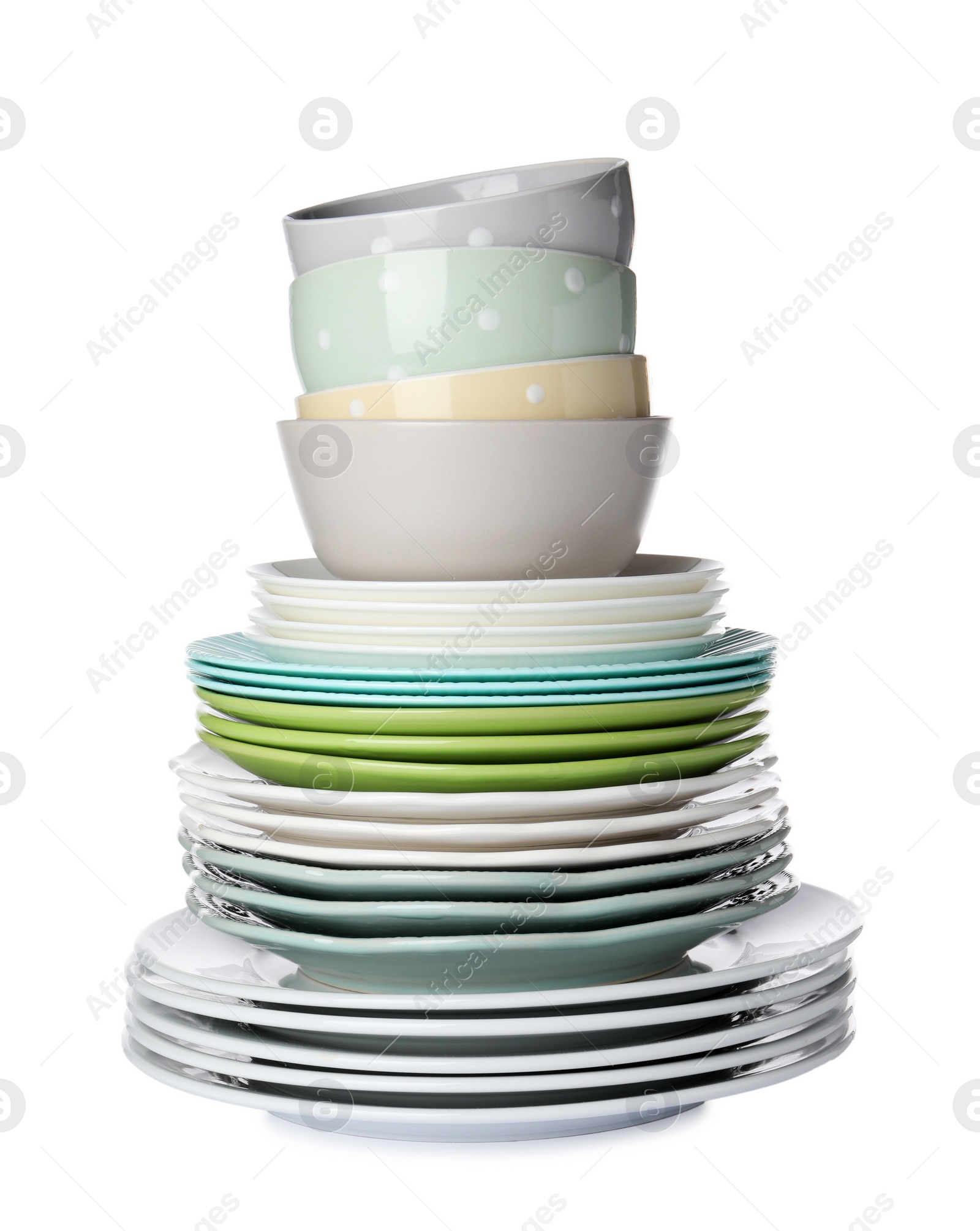 Photo of Beautiful ceramic plates and bowls isolated on white