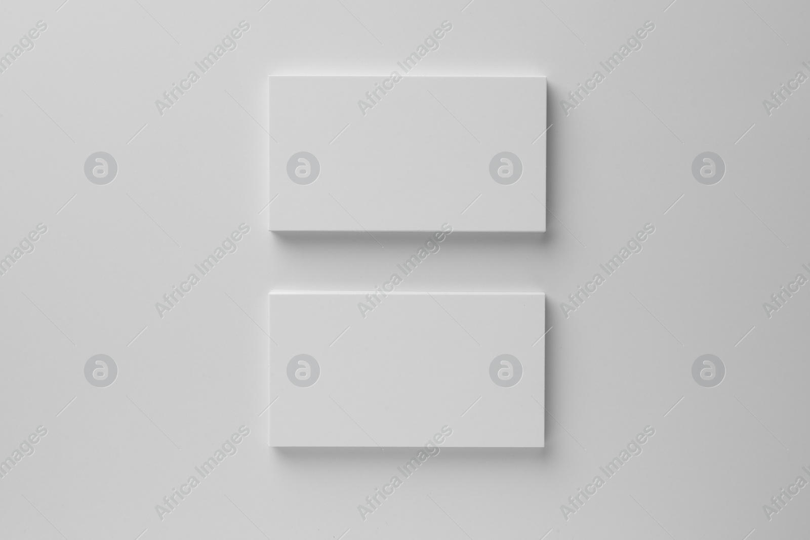 Photo of Blank business cards on white background, top view. Mockup for design