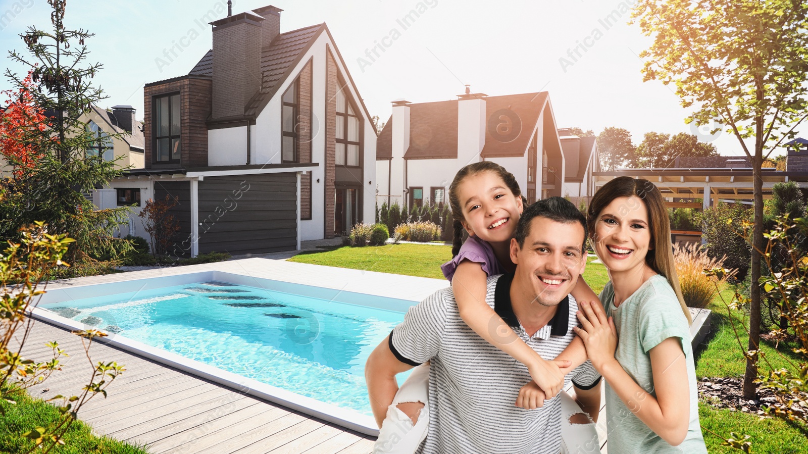 Image of Happy family smiling near their new house