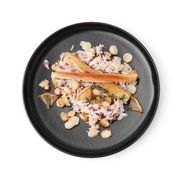 Photo of Plate with baked salsify roots, lemon and rice isolated on white, top view