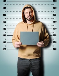 Image of Criminal mugshot. Arrested man with blank card against height chart