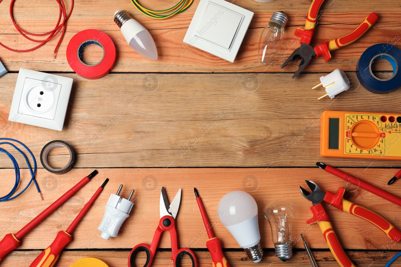 Photo of Flat lay composition with electrician's tools and space for text on wooden background