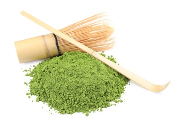 Photo of Green matcha powder, bamboo spoon and whisk isolated on white