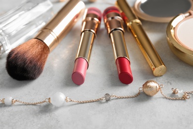 Photo of Composition with bright lipsticks on grey background