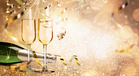 Image of Glasses and bottle of sparkling wine on bright festive background, banner design